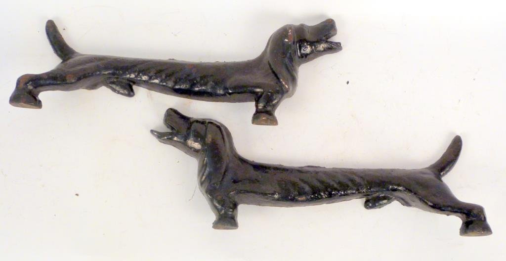 Pair of Half Cast Iron Dachshund Doorstops: Cast in halves (2 legs each). 20" L.