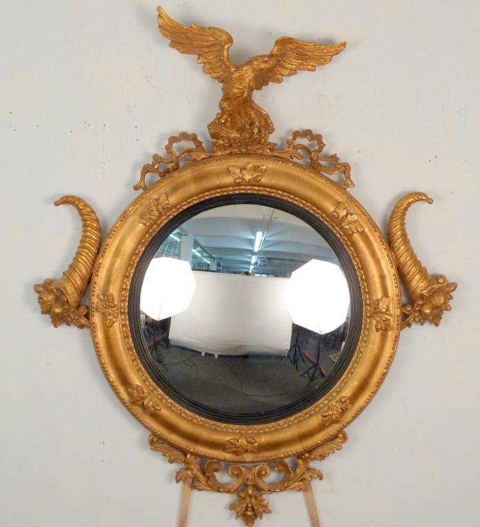Federal Style Convex Mirror: Gilt resin, with eagle pediment and cornucopia sides. 54 1/2 H X 44" W."