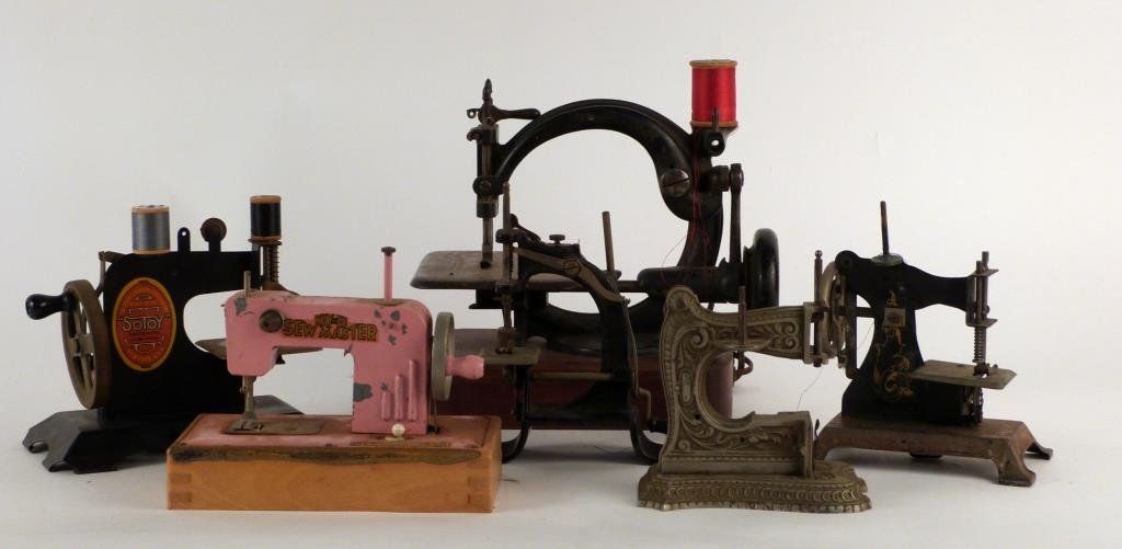 6 Assorted Miniature Sewing Machines: Various styles and periods. Largest: 9 1/2" H.