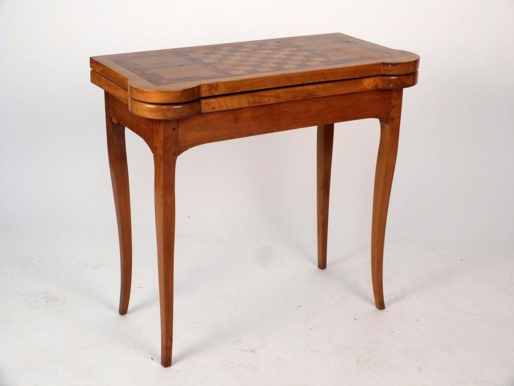 Antique Games Table: Parquetry flip top with replaced felt liner, saber legs. 31 1/2" W X 15" D X 28 1/2" H.