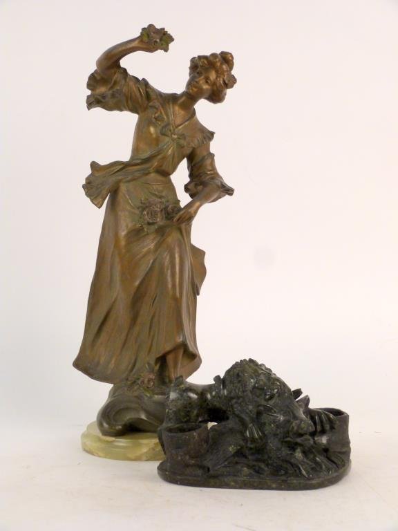 2 Sculptures (as is): Metal figure of a woman on soapstone base, together with a composite stone sculpture of a lion and hog. Taller: 19 1/2" H (including 1" base).