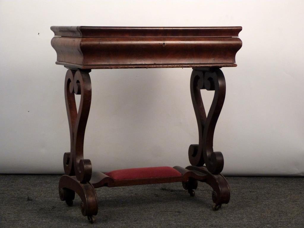 American Empire Style Dressing Table: Herringbone inlayed and banded top. ( As is) Opening to mirror and compartments. Scrolled sides and padded foot rest on casters. 26" W X 17 "D X 29" H. (Rye, NY Estate)