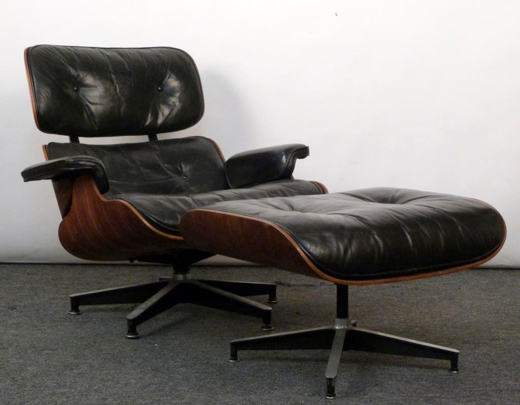 Charles and Ray Eames Rosewood 670 Lounge Chair: Charles and Ray Eames Rosewood 670 Lounge Chair and 671 Ottoman. Rosewood frame with tufted black leather, enameled aluminum.. 32" W X 34" D X 32 1/2" H; ottoman: 25 1/2" W X 22" D X 16 1/2" H. Leathe