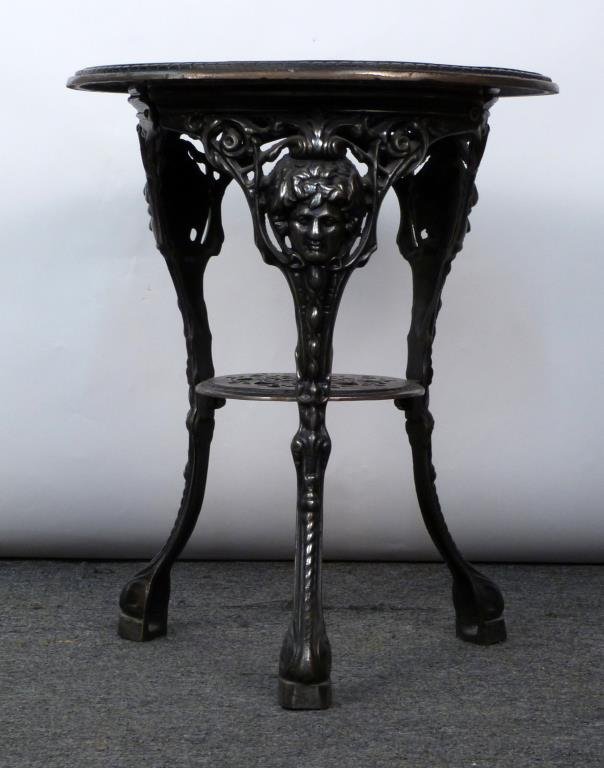 Cast Iron Pub Table: Pierced top with Celtic knot, hoofed feet. 23" D. X 28" H. (320 Central Park West Estate)