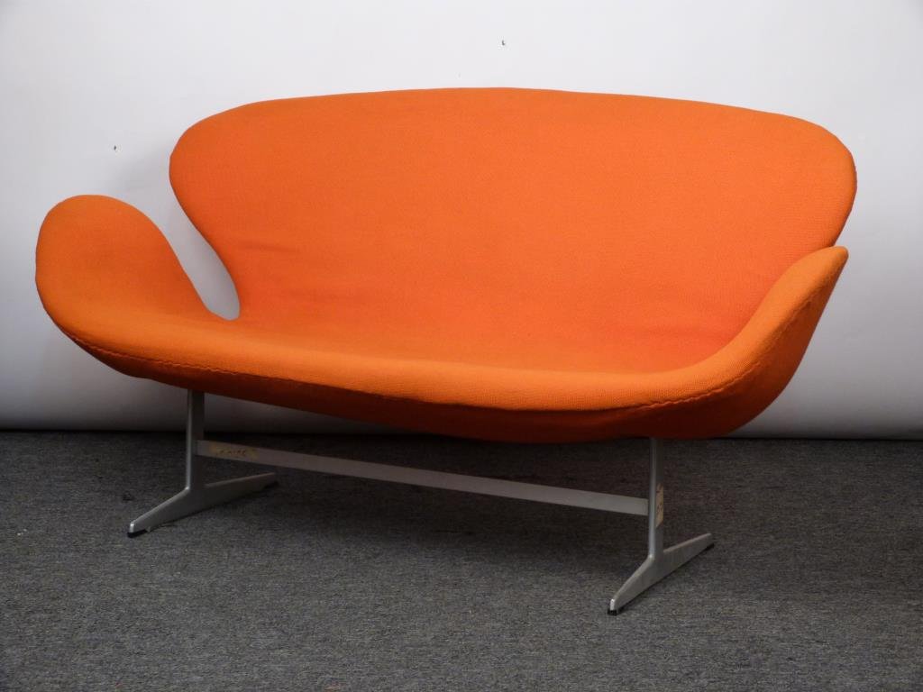 Arne Jacobsen for Fritz Hansen Swan Settee: Orange upholstered body, aluminum legs. 57" W X 29" D X 31" H. (145 Central Park West Estate)