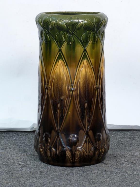 American Art Pottery Umbrella Stand: Raised decoration with green to mushroom brown glaze, marked No 7. 22 H X 11 D.