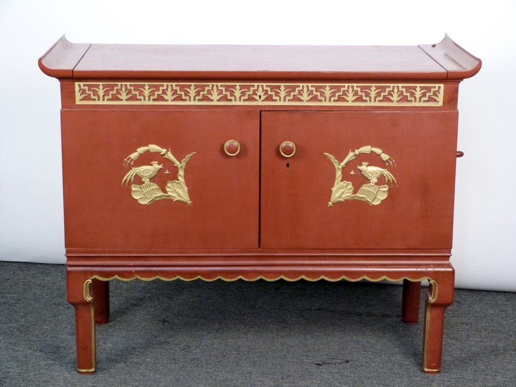 Grammonium Chinoiserie Style Stereo Cabinet: Red lacquer with gold detail, scroll reading style top. Only right door opens. 47 1/2 W X 21 D X 37 H. In the James Mont Manner.