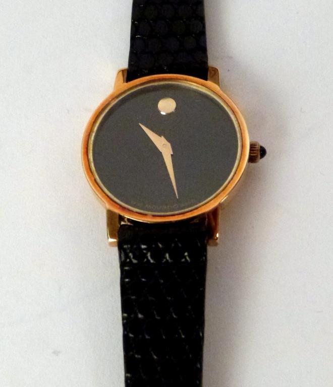 Movado Ladies' 14K Gold Watch: With 2 Movado bands, in box with owners manual. Face: 3/4 H X 1" W; total: 8" L."