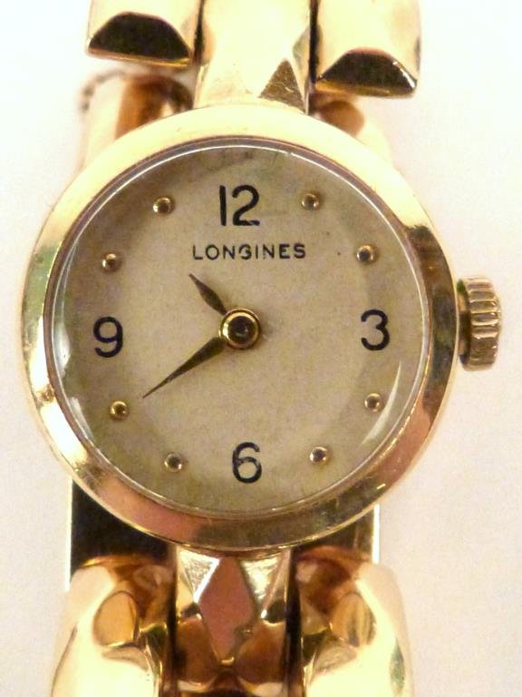 Longines 14K Gold Ladies' Watch: Fits small to medium size wrist. Total weight: 34 grams.