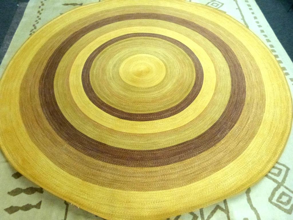 Round Aleman and Moore Sewn Straw Carpet - 12' D: Neutral colors in circular pattern.