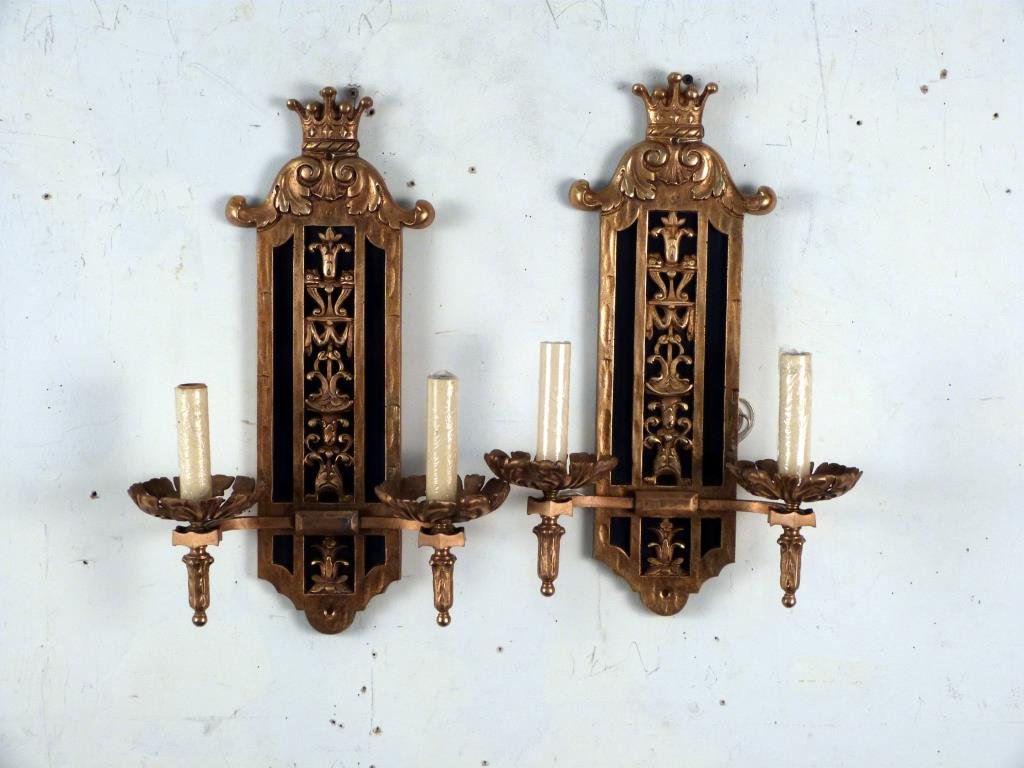 Gilt and Ebonized Metal Sconces: 2 lights each, with crown pediments. 16 1/2 H."