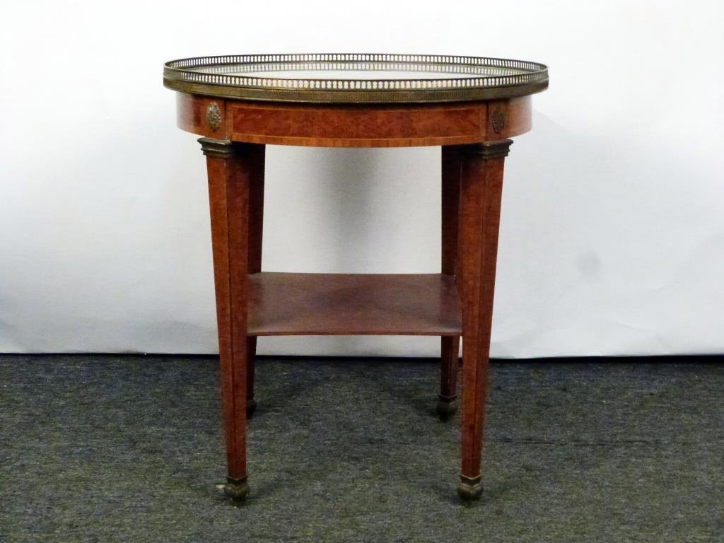 French Marble Top 2 Tier Gueridon: Galleried marble top (needs remounting to base) on 4 tapered square legs with a lower tier. Gilt metal feet caps. 25 Dia X 28"H."