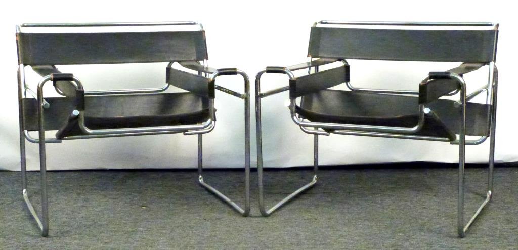 Pair Marcel Breuer For Knoll Wassily Chairs: Heavy stitched black leather on chrome frames with Allen key construction. Some wear to leather and slight pitting in chrome. 1 with Knoll Label. 31W x 27"D x 28 1/2"H."