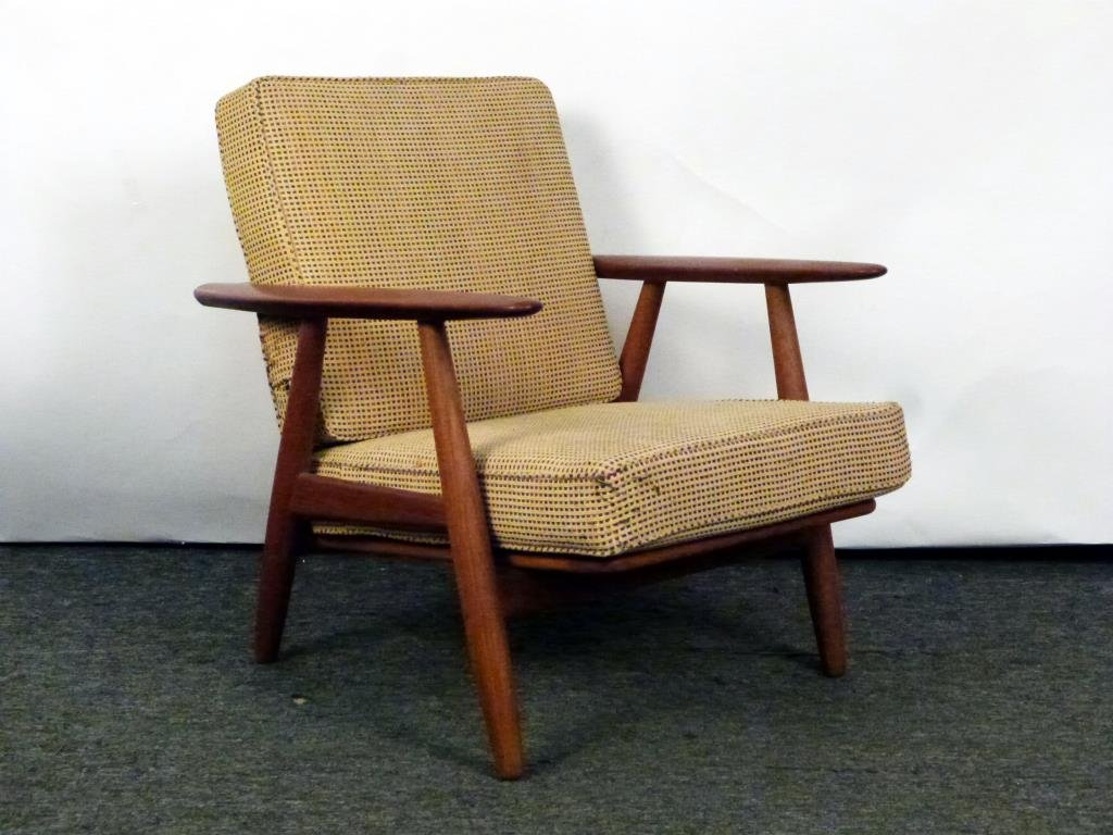 Mid-Century Arm Chair: Upholstered back and seat cushions (as is). Flat top arms above tubular tapered walnut supports. No labels, in good structural condition. 26.5W X 32"D X 29.5"H. Also Danish Modern, Scandinavian design