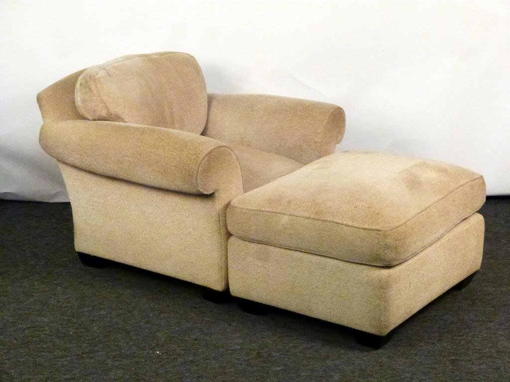 John Hutton / Donghia Club Chair and Ottoman: Down seat and back cushion in Donghia Fabric. Good condition, slight stain. John Hutton design for Donghia. 40W X 35"D X 34"H. (32" X 27" X 18")"
