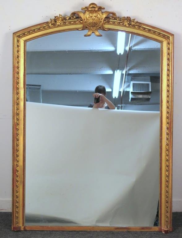 Early 20th Century George III Style Pier Mirror: Gold leaf frame, Twist and beaded with shield pediment on dome top. 64.5 H X 46.5" W. As is."