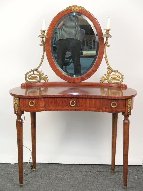 French Style Mirror Back Vanity: Kidney shape, banded and line inlaid, gilt metal mounted, with beveled oval mirror flanked by 2 lights. 38 W X 19" D X 54" H."