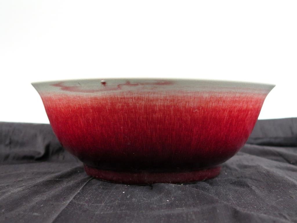 Chinese Ox Blood Glazed Bowl: Porcelain, with flared mouth, marked. 4 H X 10" D."