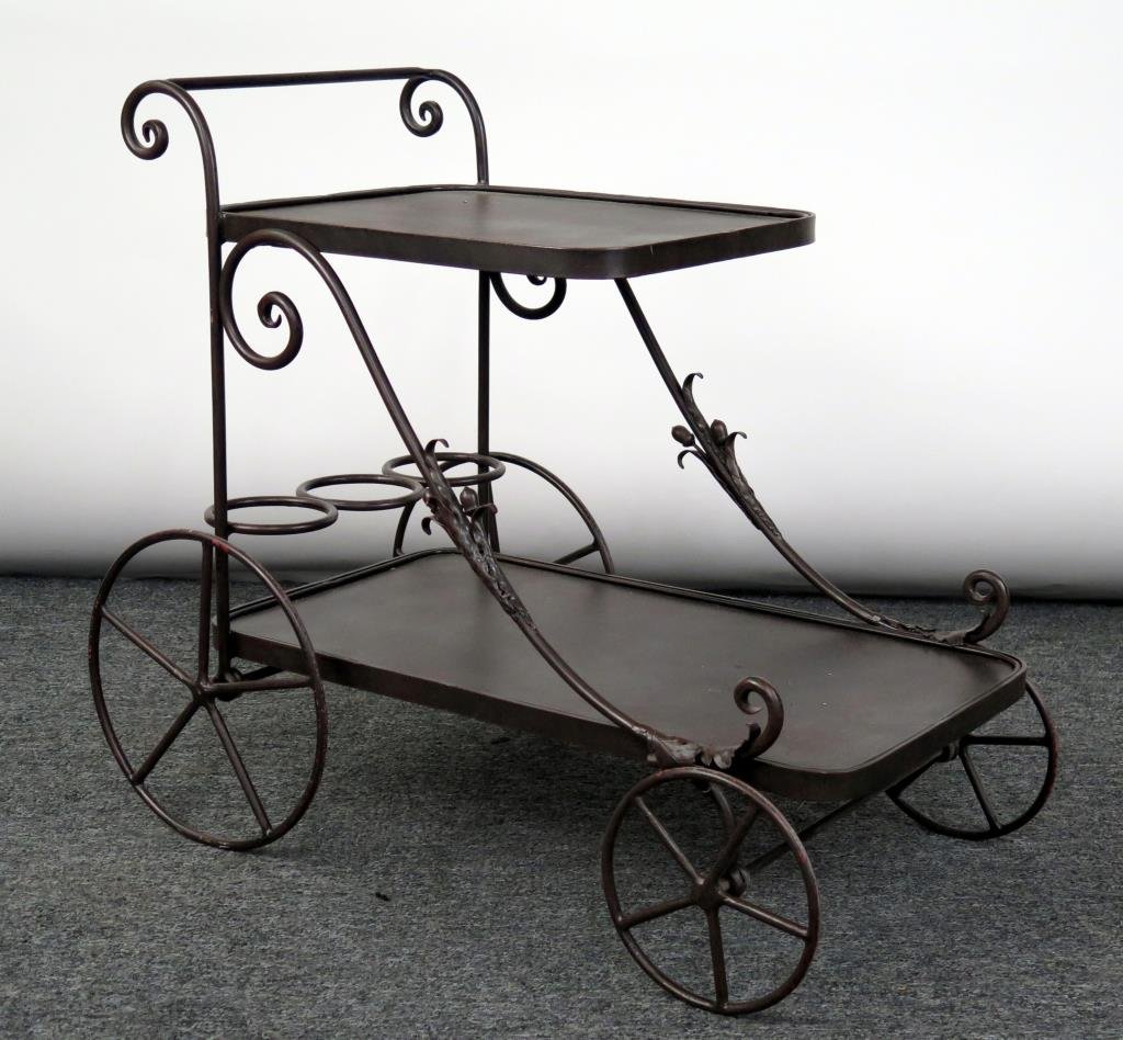 Patinated Iron Bar Cart: 2 Stepped shelves, acorn detail on scrolled and swooping side supports. 32 W X 18" D X 27.5" H."