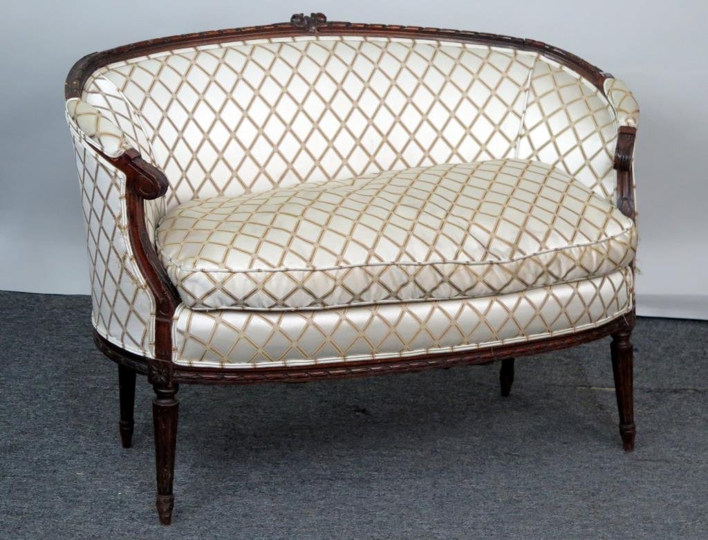 Louis XVI Style Settee: Carved wood frame, wrapped sides, tapered and fluted legs, down seat. 47 W X 27" D X 23" H."