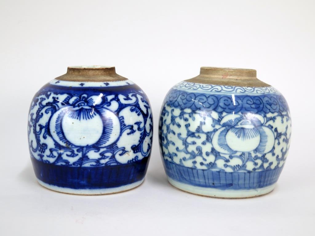 2 Chinese Blue & White Ginger Jars: Bulbous porcelain forms with rounded shoulders. 5 H. Lacking lids."