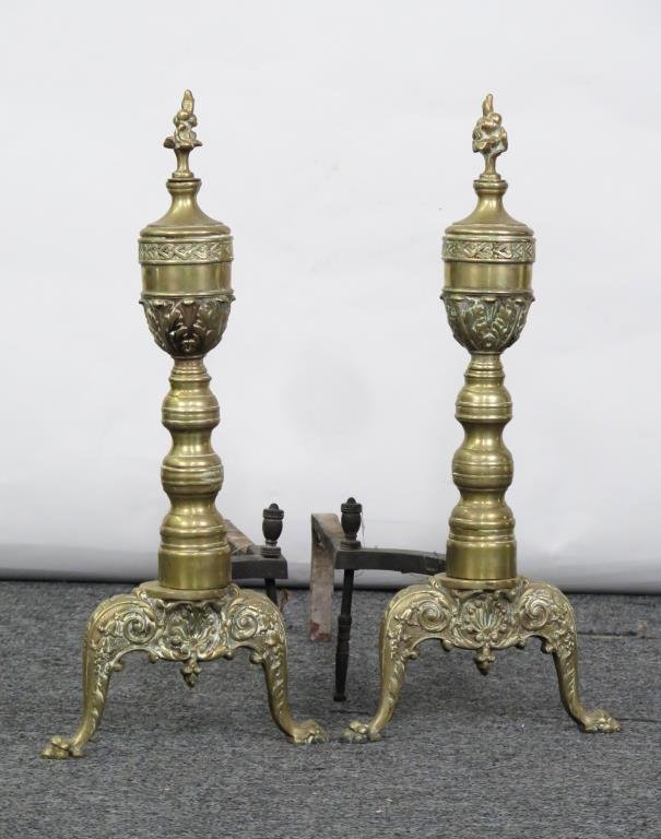 Pair Victorian Style Andirons: Brass with flame finial and paw feet. 10.5" W X 23.5" H.