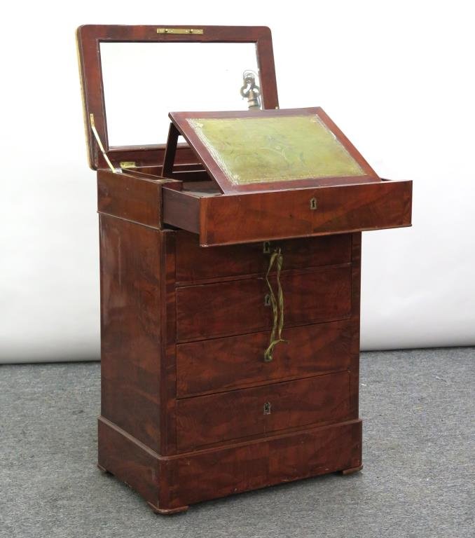 English Style Diminutive Writing Chest: Marble lift top opening to tooled leather surface and pigeon holes, figured wood body, 4 drawers with brass escutcheons and fine dovetailing, on casters. 22.5 W X 14.5" D X 32" H. Marble repaired."