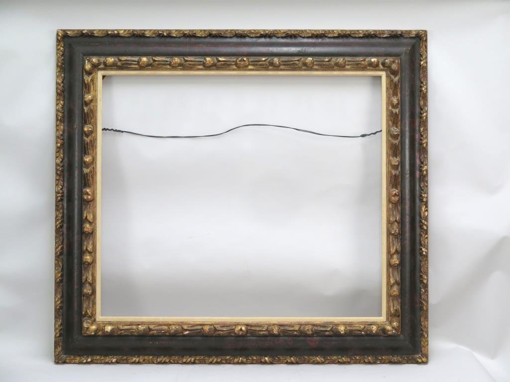 Carved Wood Picture Frame: Ebonized and parcel gilt. Rabbet: 31 H X 36" W (40" X 45")."