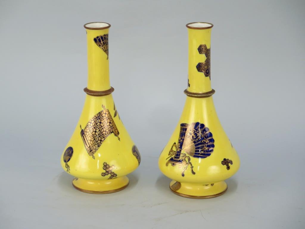 Pair of English Porcelain Vases: Gilt and blue Chinese design on yellow ground. Royal Worcester marks. 5.5 D X 10.5" H. (From an East Hampton Estate)"