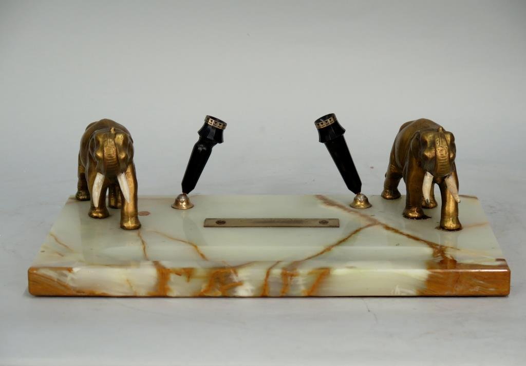 Onyx Desk Set With Elephants: Painted metal tusks, 2 plastic pen holders in between. Left tusk on left elephant loose. 14"W X 8"D X 4"H