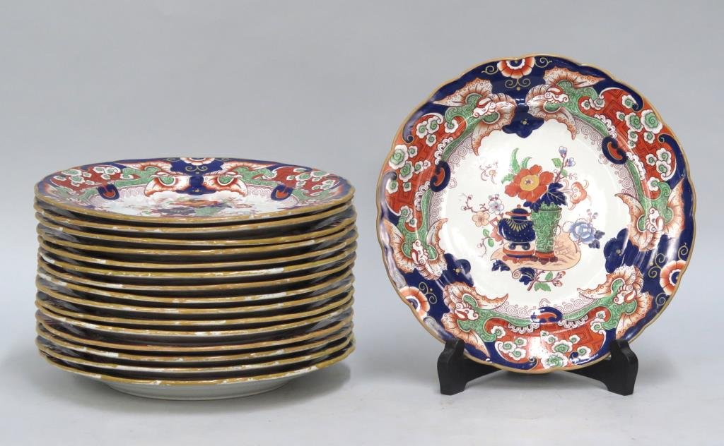Set of 16 Ironstone Porcelain Dinner Plates: Set of 16 Ironstone Porcelain Dinner Plates With polychrome floral motif. Some with stains and wear to color. As is. 10Dia.