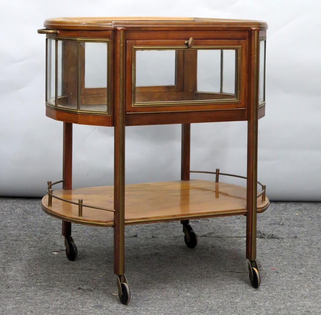 Rockhausen Glass Top Bar Cart: Vitrine top with opposing doors, lower shelf with brass gallery. Scuff marks, one brass plate lifting. As is. 30"W X 19.5"D X 31"H. (From a Great Neck, NY Estate)