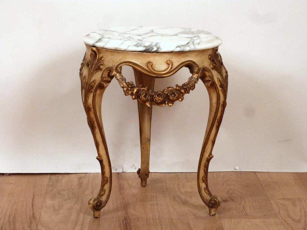 English Style Tripod Urn Stand: Beveled marble top, painted and gilt carved base. All valences repaired. 16Dia. X 18"H. (Estate of Dwain DePaul, Brooklyn, NY)"
