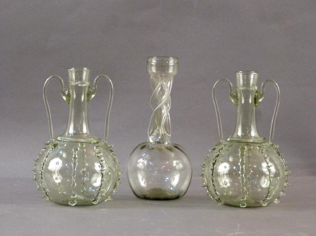 3 Green Glass Decanters - Pair and Single: 2 - 2 handle wine jugs in 'pinch base' style and one open twist neck vase (9.5H)."