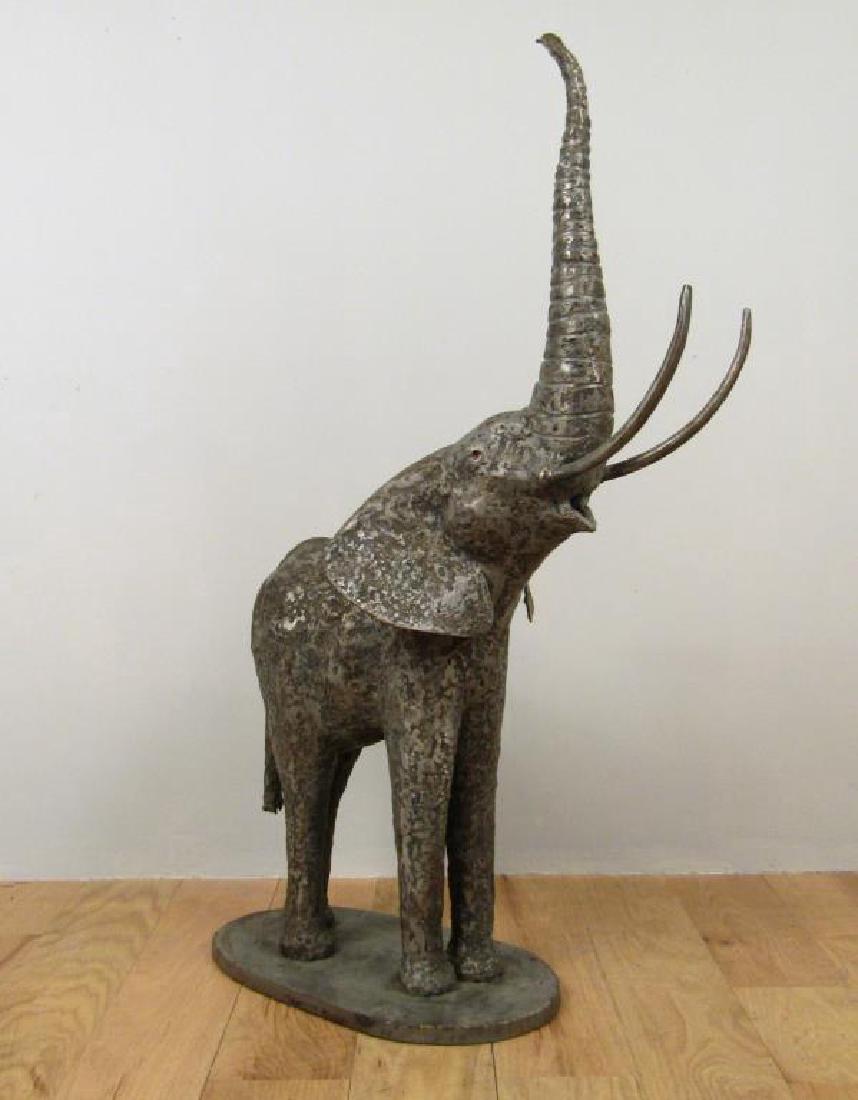 Metal Sculpture - Steel Elephant: With raised trunk and red painted eyes. Signed Hambleton at base. Approx. 15W X 29.5"D X 44"H"