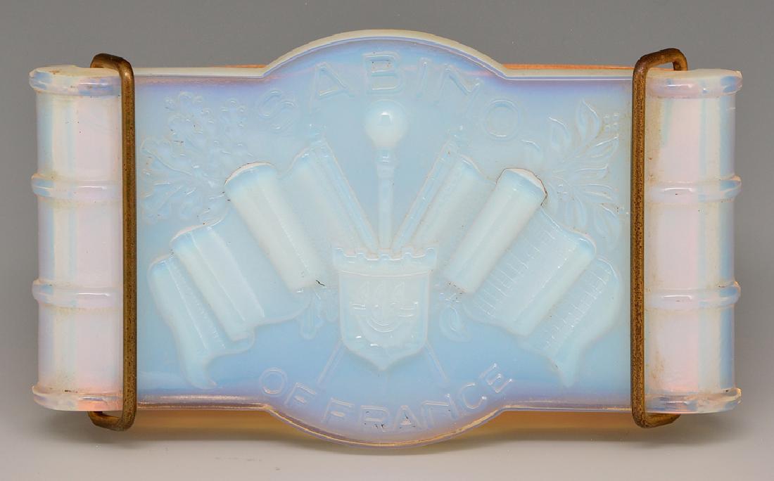 Sabino opal glass advertising blotter: Sabino opal glass advertising piece, a blotter decorated with flags and "Sabino France", retains clips and blotter paper. Appx 6"w. Very good condition.