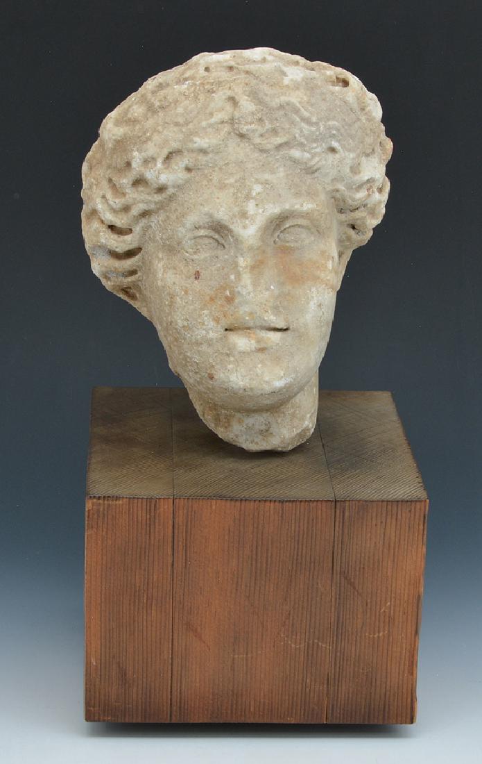 Roman marble fragment of female head on stand (1 of 4)