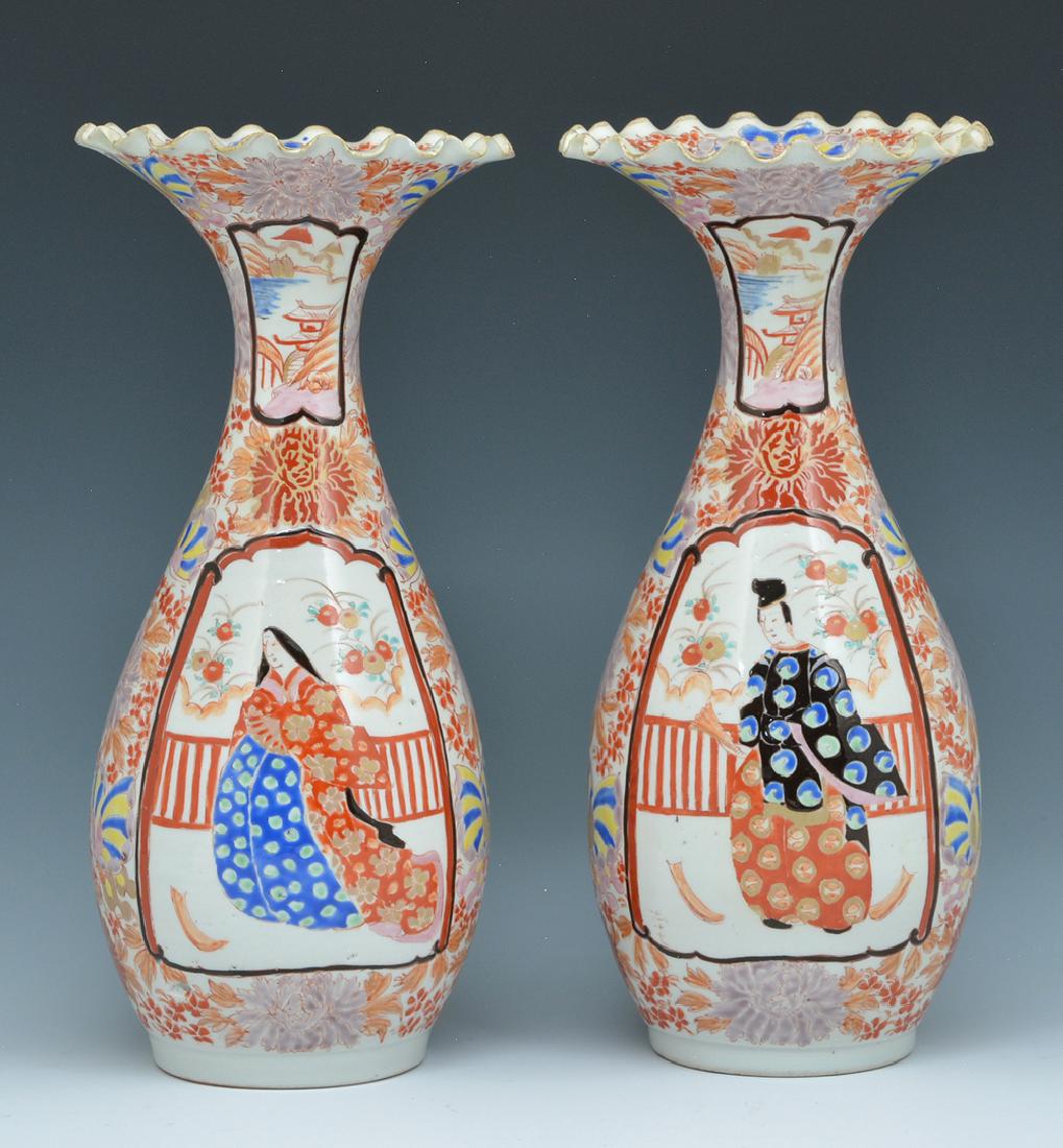 Pair of Japanese porcelain vases: Pair of Japanese porcelain vases with elongated necks and ruffled rims, decorated with foliate designs and figures of men and women in kimonos. Appx 12"t.
