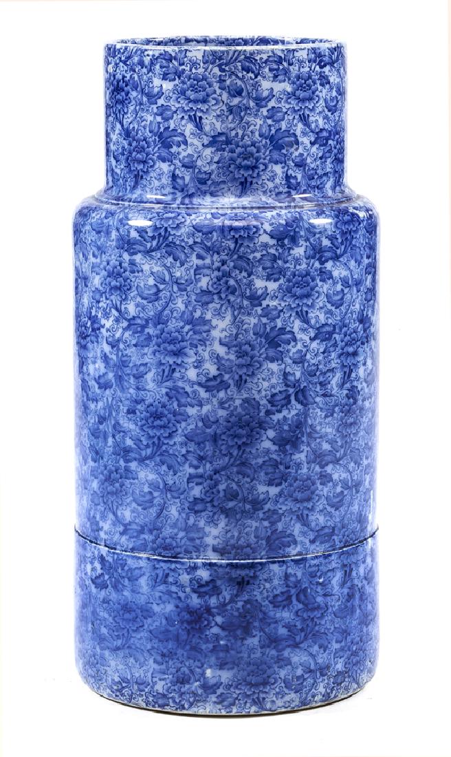 Doulton Burslem porcelain umbrella stand: Doulton Burslem porcelain umbrella stand with blue floral decoration, marked on bottom "Doulton Burslem England" and "Ivory". Appx 24"t x 11 1/2"dia. Very good condition with minor glaze imperfections