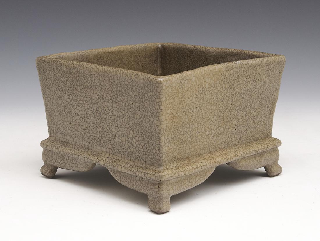Rare koyao "fish-roe crackled" planter: Rare koyao "fish-roe crackled" planter. Of square body with gently flared sides, supported on a flanged base with bracket corners on four short legs, covered all over with a mottled ash gray glaze suf