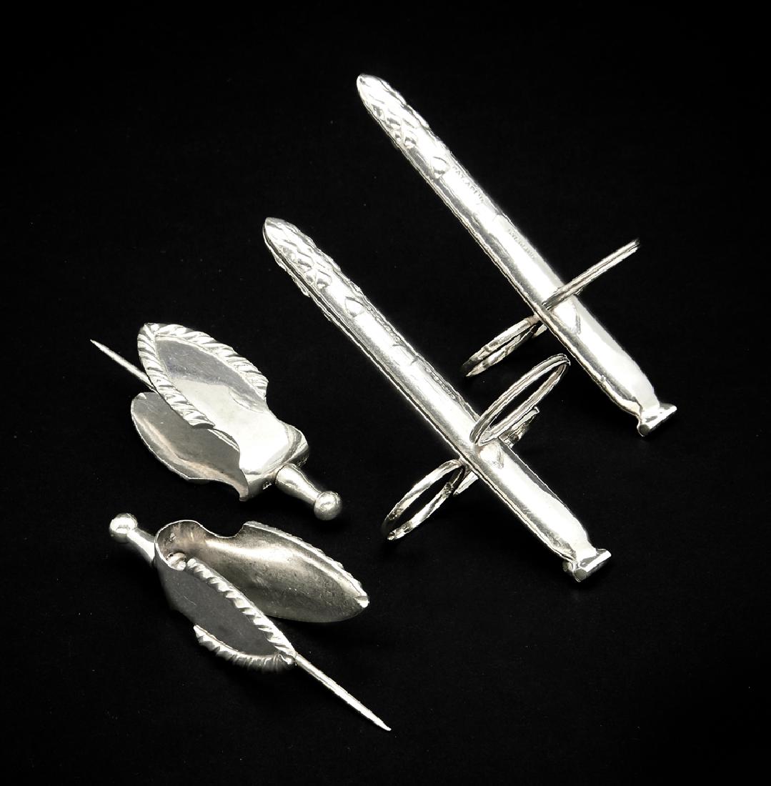 2 Sterling asparagus tongs and 2 800 silver lemon: 2 Sterling asparagus tongs, appx 4 1/4"l, and 2 800 silver lemon squeezers, all marked. Total weight appx 3.1 ozt. Very good condition.