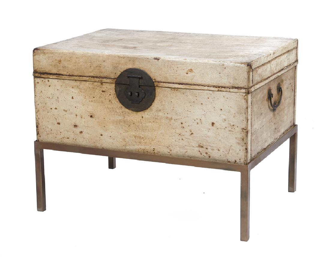 Chinese pigskin trunk on painted metal stand (1 of 1)