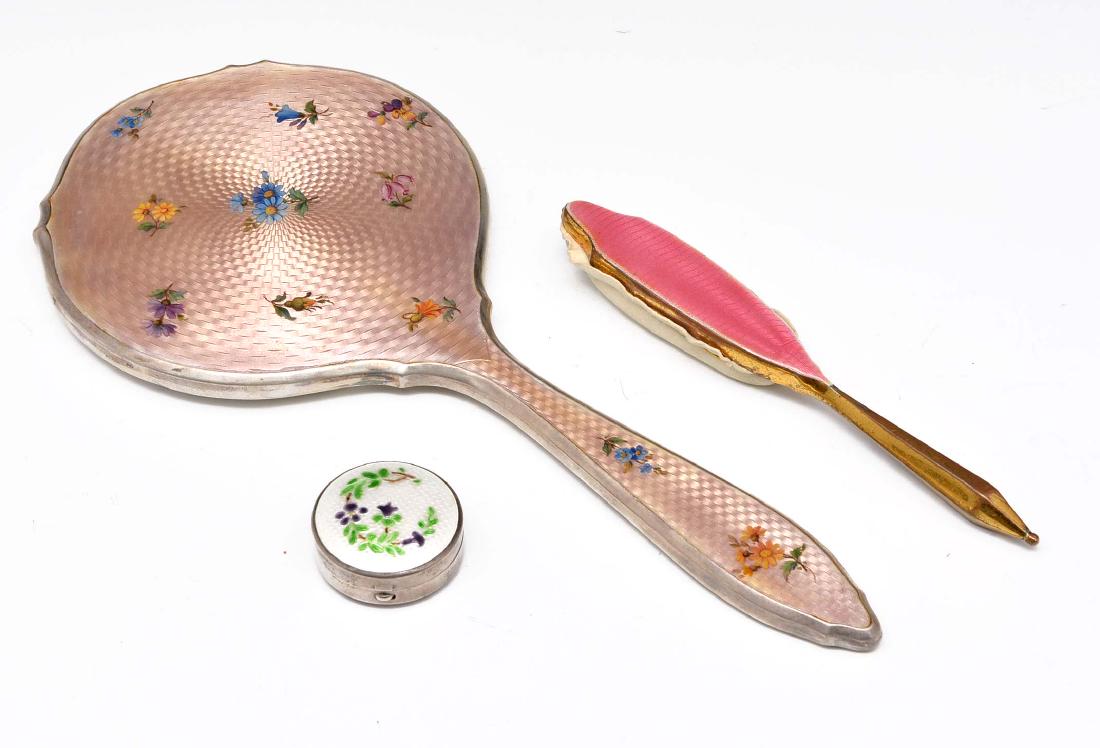 Grouping of three guilloche enamel objects: Grouping of three guilloche enamel objects with floral design. Includes hand mirror, box, and nail buff. Mirror and box marked sterling. Mirror appx 11 1/4" L.