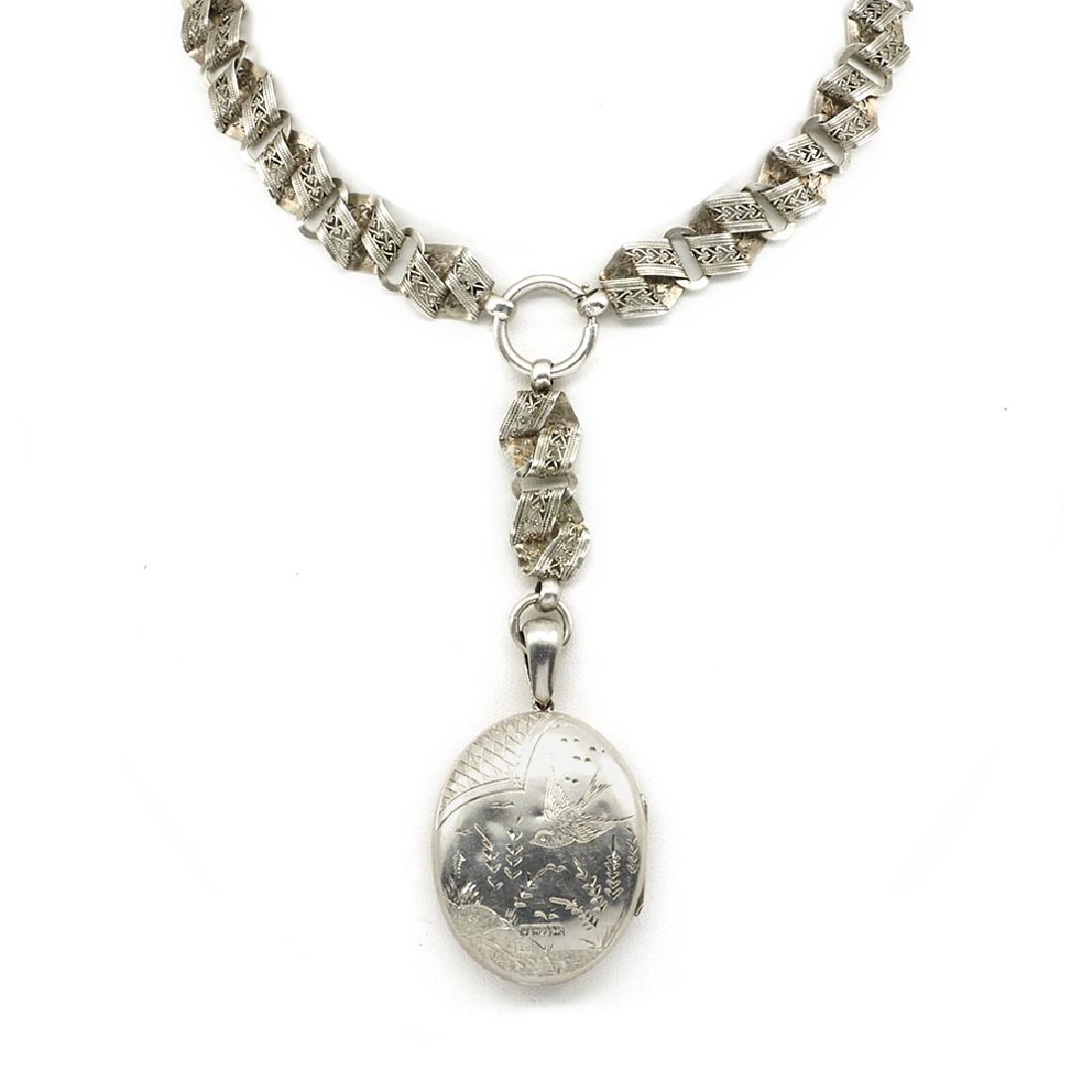 Sterling silver Victorian engraved locket on an ornate (1 of 2)