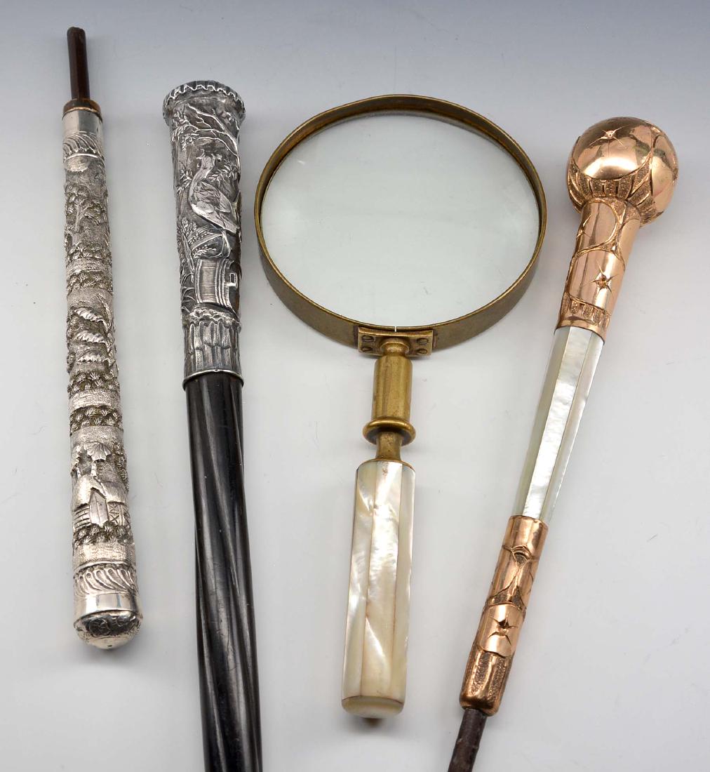 Three ornate parasol handles & magnifier (1 of 3)