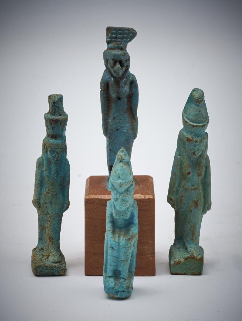 Grouping of four Egyptian blue faience amulet figures (1 of 2)