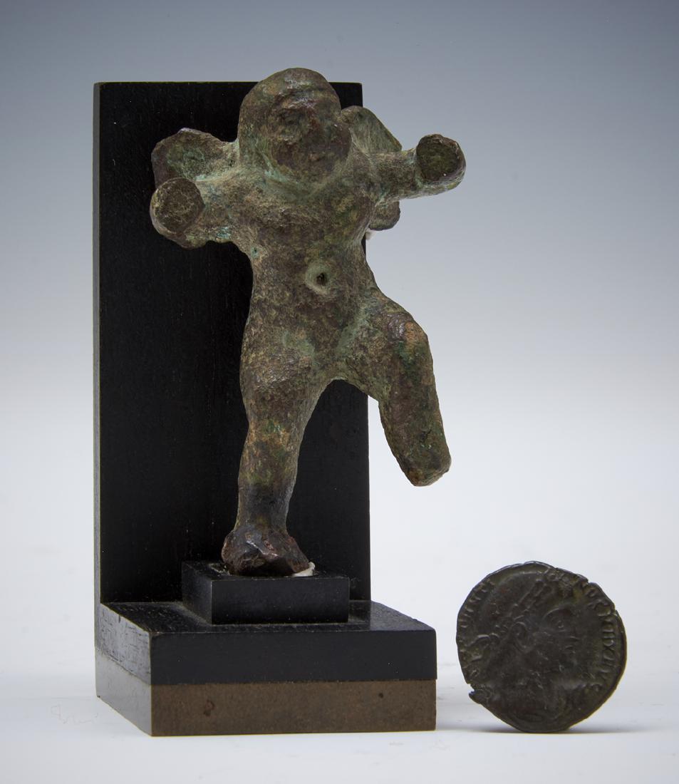 Roman bronze cupid figure on stand and ancient coin (1 of 2)