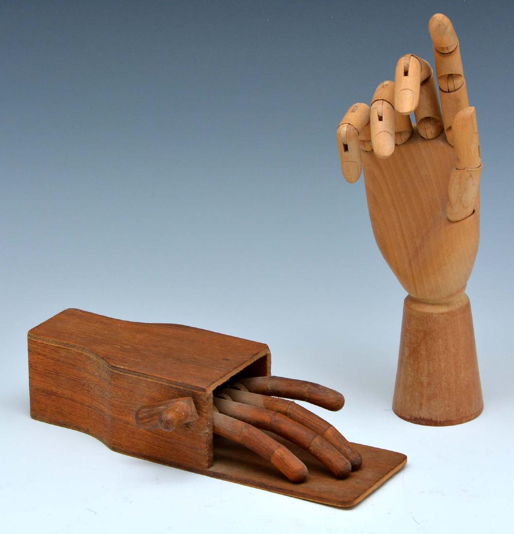 Grouping of two wood novelty model hands (1 of 3)