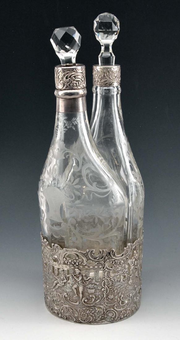 Fine two-bottle etched glass decanters in silver base (1 of 3)