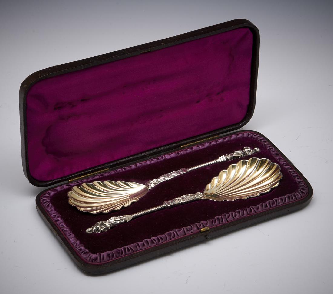 Pair of cased Apostle spoons: Pair of cased apostle spoons, finial in the form of an apostle holding a wafer over a chalice, twist stem, gold washed shell bowl, hallmarked William Hutton & Sons, London, 1886, in fitted case, appx